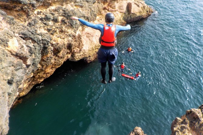 Coasteering and Cliff Jumping Near Lagos - Coasteering Techniques on Cliffside Beach