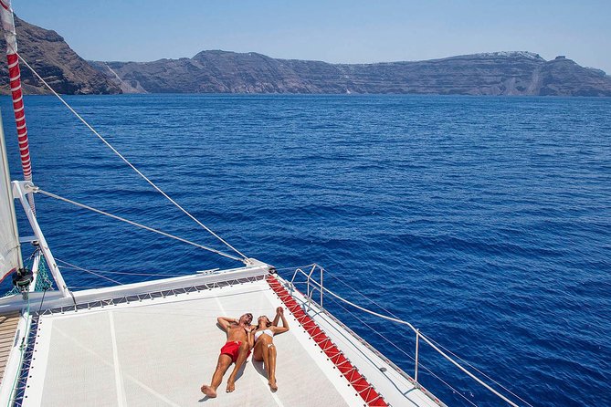 Santorini Cruise on Catamaran With BBQ & Open Bar - Pricing and Booking Details