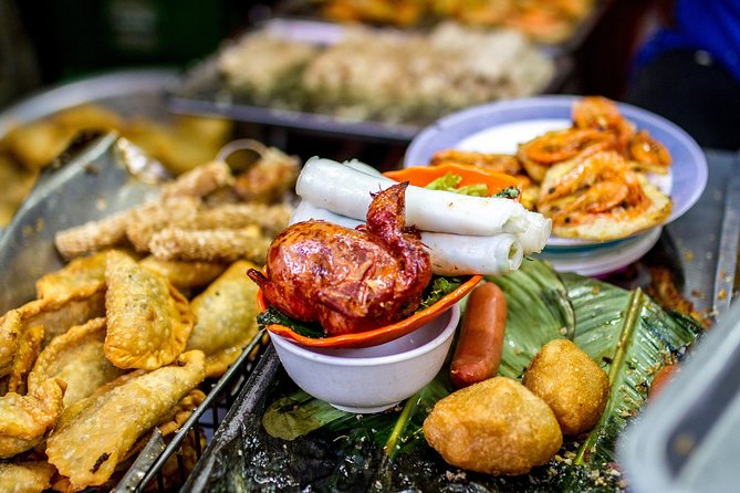 5-Hour Experience Hanoi Night Life With Street Food and Water Puppet Show - Iconic Landmarks and Hidden Gems