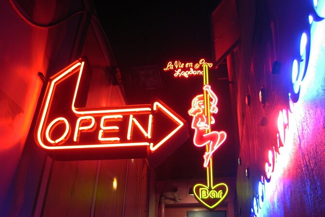 Amsterdam: Guided Red Light District and City Walking Tour - Language Options and Cancellation Policy