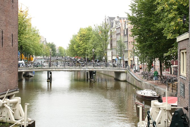 Amsterdam Historic City Walk - Exploring the Charming Canals and Bridges