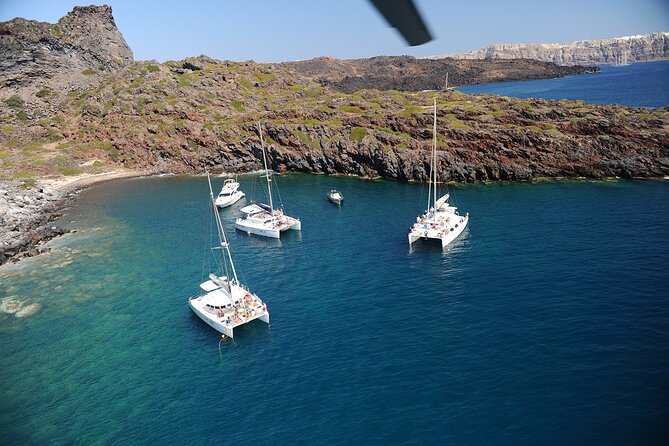 Santorini Classic Catamaran Cruise With Meal Drinks and Transfers - Snorkeling and Swimming Stops
