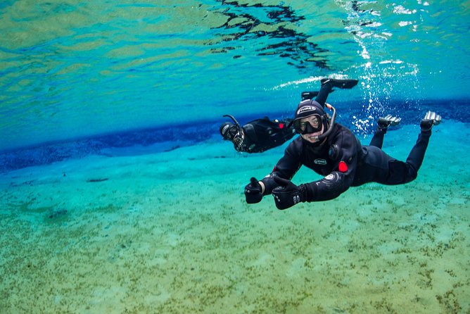 Small-Group Snorkeling in Silfra With Transfer & Free Photos Included - Plunging Into Silfra Fissure