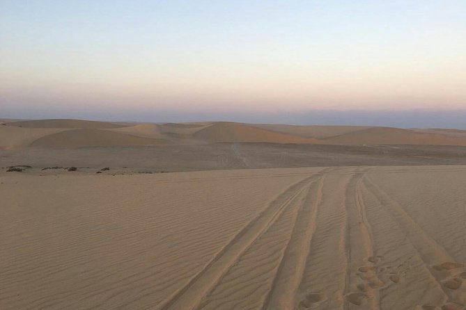 Private Sunrise Desert Safari BashingCamel RideSand BoardingInland Sea Visit. - Common Questions