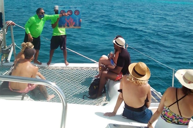 Catamaran to Isla Mujeres, Open Bar, Buffet, Beach Club Included - Snorkeling, Partying, and Beach Relaxation