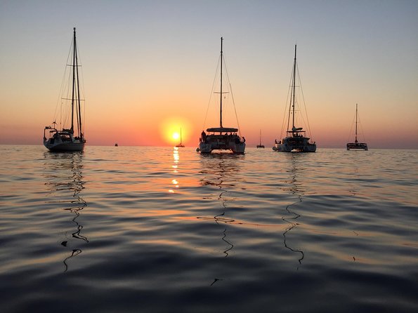Santorini Luxury Catamaran Sunset Cruise With BBQ, Drink and Transfer - The Sum Up