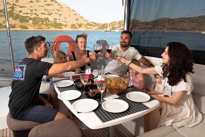 Agios Nikolaos Evening Catamaran Cruise in Mirabello With Dinner - The Sum Up