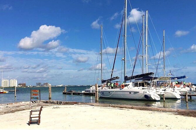 Catamaran to Isla Mujeres, Open Bar, Buffet, Beach Club Included - The Sum Up