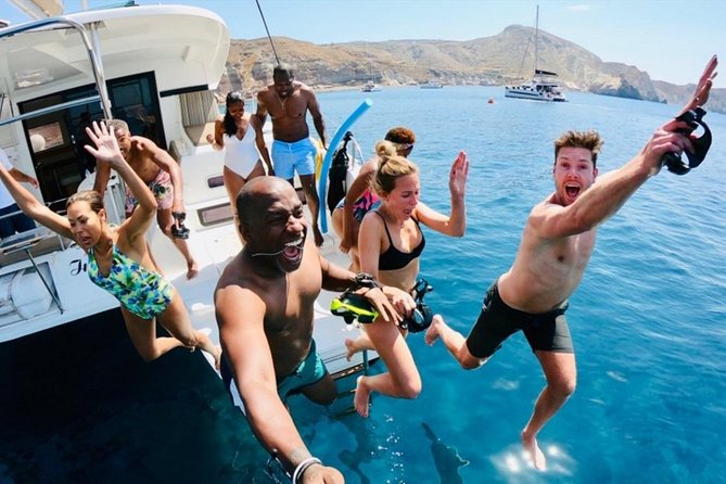 Santorini Caldera Gold Sunset Cruise With BBQ on Board and Open Bar - Onboard Experience and Services