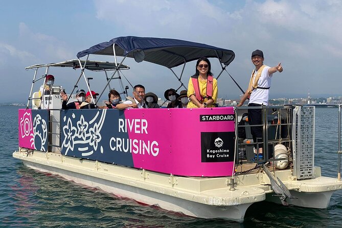 Boat Cruising in Front of the Active Volcano Sakurajima