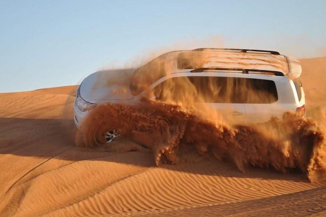 Evening Desert Safari With Camel Ride, BBQ Dinner and Dune Bashing - Sand Surfing and Sunset Photography