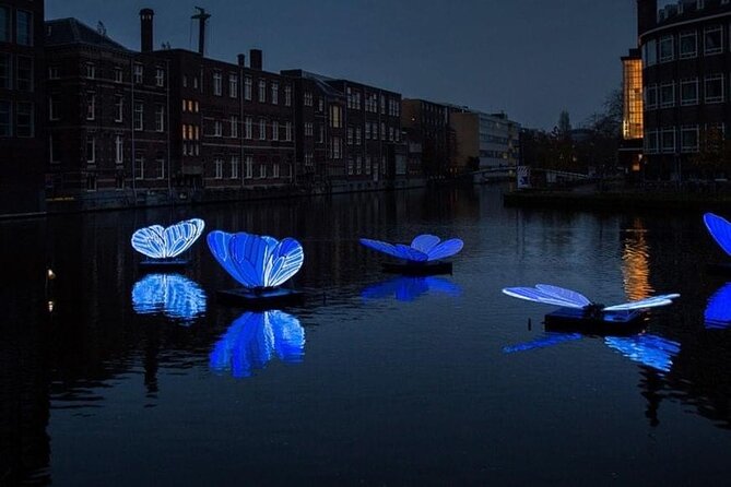 Mikes Amsterdam Light Festival Bike Tour With Gluhwein or Hot Chocolate - Tour Highlights