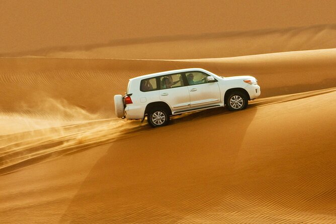 VIP Red Dunes Desert Safari ,BBQ Dinner, Belly Dance & Fire Show - Experience the Red Desert Magic