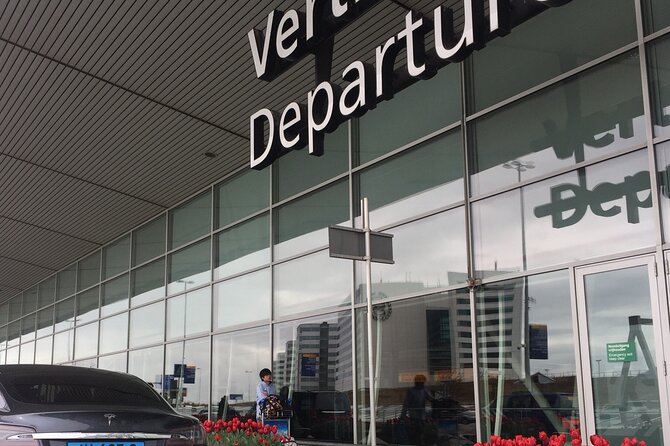 Zero Emission Tesla Taxi Transfer From Leiden Area to the Airport