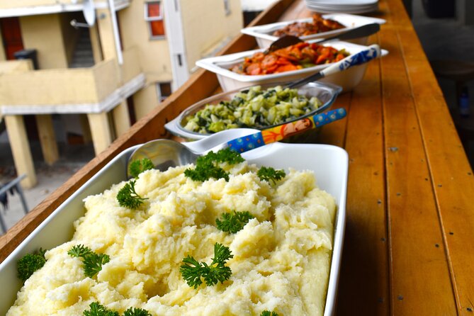 African Meal W/ Chef Founder Experience W/ Hotel Pickup & Photoshoot Add-Ons - Logistics and Transportation