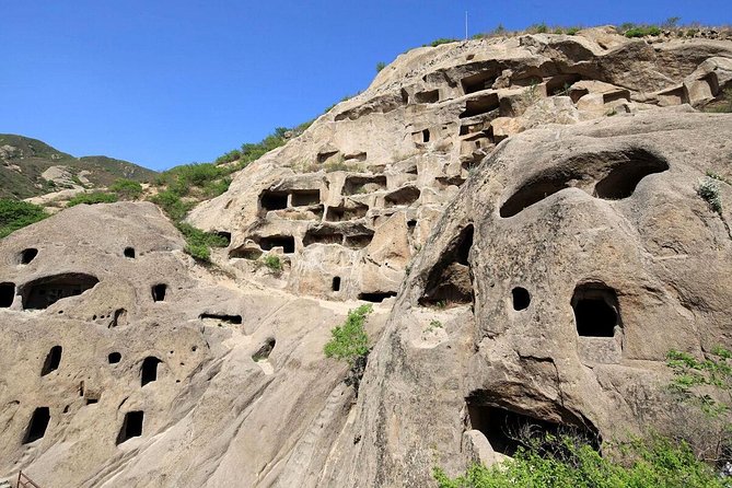 Private Day Tour to Longqing Gorge & Guyaju Cave Including Boat Ride - Tour Highlights