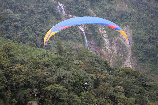 Paragliding Flight Over a Valley of Mountains and Waterfalls Video - Good To Know