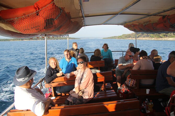 Dolphin Watching Sunset Boat Trip in Pula With Dinner - Inclusions