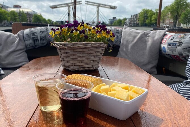 Dutch Cheese and Drinks Guided Amsterdam Canal Cruise With Locals - Tour Highlights