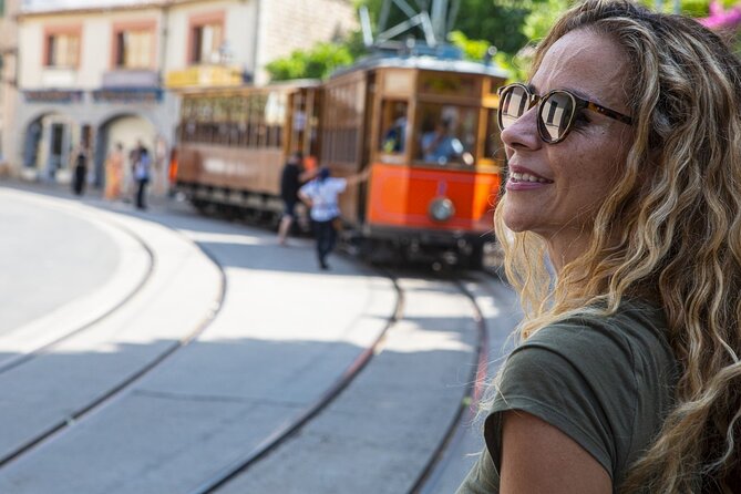 Island Tour With Train Tram Boat and Bus From Cala Millor