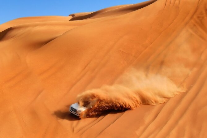 Private Dubai Sunrise With Red Dune Bashing Camel Ride Boarding - Refreshments