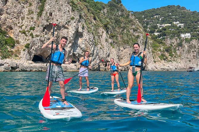 Capri: Faraglioni Rocks and Blue Grotto Paddleboarding Tour