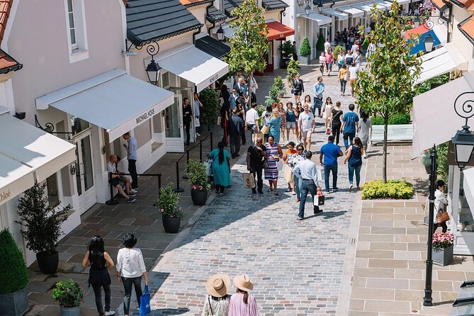 CDG Pick up With Montmartre and La Vallée Village Tour - Tour Inclusions