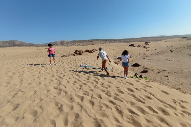 Experience the Sandboarding and Painted Village Half Day