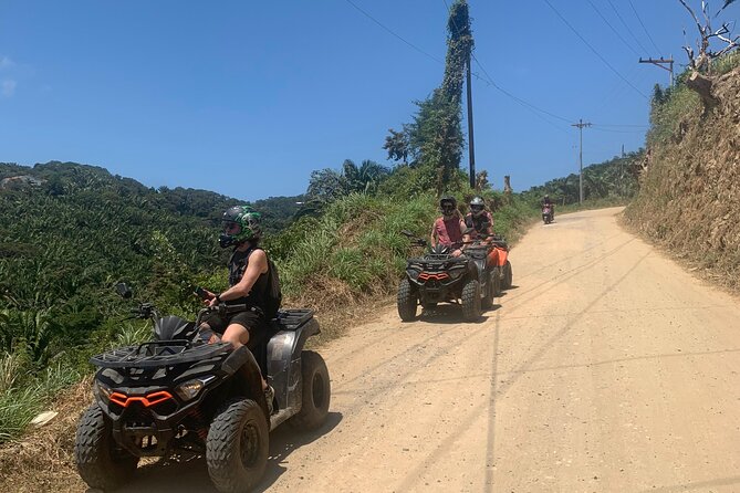 Guided ATV Tour on Mountain Dirt Road With Views of Roatan