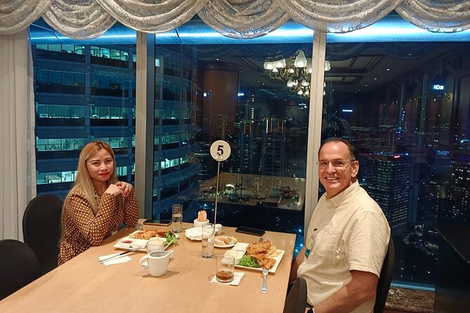 Petronas Twin Towers Skybridge View & Dining Experience Tour With Local Host - Tour Highlights