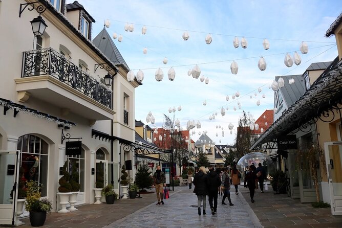 CDG Pick up With Montmartre and La Vallée Village Tour - The Sum Up