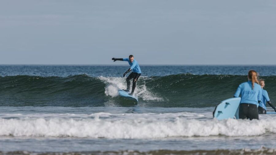 Learn to Surf in the Clear Waters of Beautiful Cullen Bay