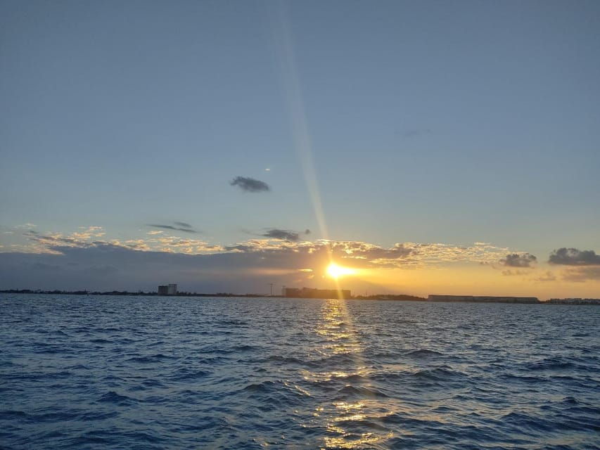 Sunset Sailing to Isla Mujeres With Cancún Transfer
