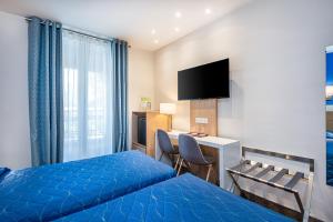 Hotel Terminus Montparnasse - Room Types and Amenities