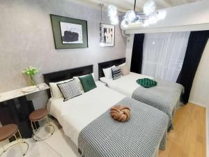 G22 New Inn, Shinjuku Center, 5 Mins to Station, Max 3 Direct Access to Shinjuku, With a Hot Spring Bath and Rooftop Terrace, Original Inn With a Wooden Vibe - Frequently Asked Questions