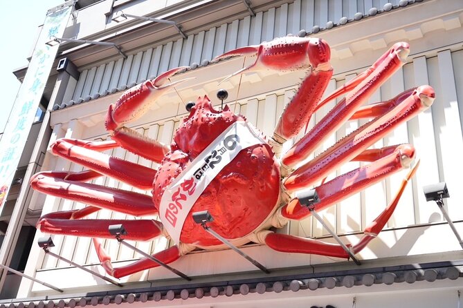 Osaka Early Bird Tour With English-Speaking Guide - Taking in Kuromon Markets Bustling Atmosphere
