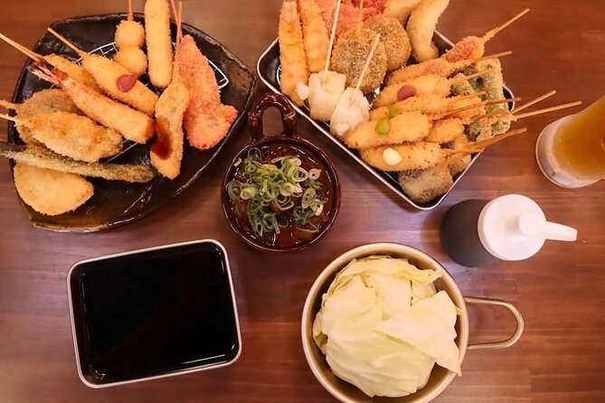 A Soul Food Tour in Osakas Shinsekai With a Local Guide - Savoring the Delectable Dishes