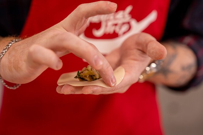 Osaka Cooking Class and Sake Tasting With Local Supermarket Visit - Cooking Menu: Okonomiyaki, Nikusui, and Yaki-Gyoza