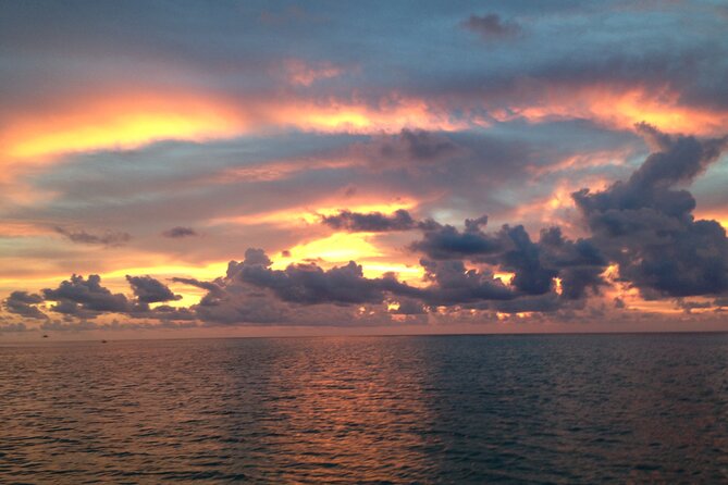 TOP SHELF TIKIS- 1.5HR Sunset Cruise - The Sum Up