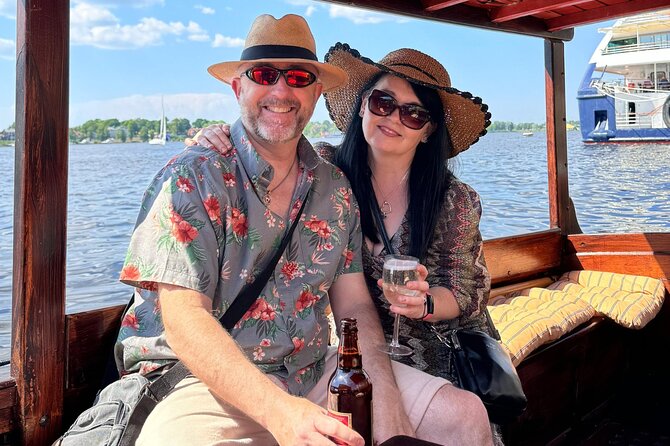 Riga: Evening or Sunset Boat Tour with Drink and Audio Guide