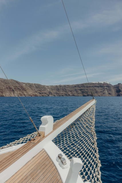 Santorini: Ios Island Overnight Sailing Trip with Meals