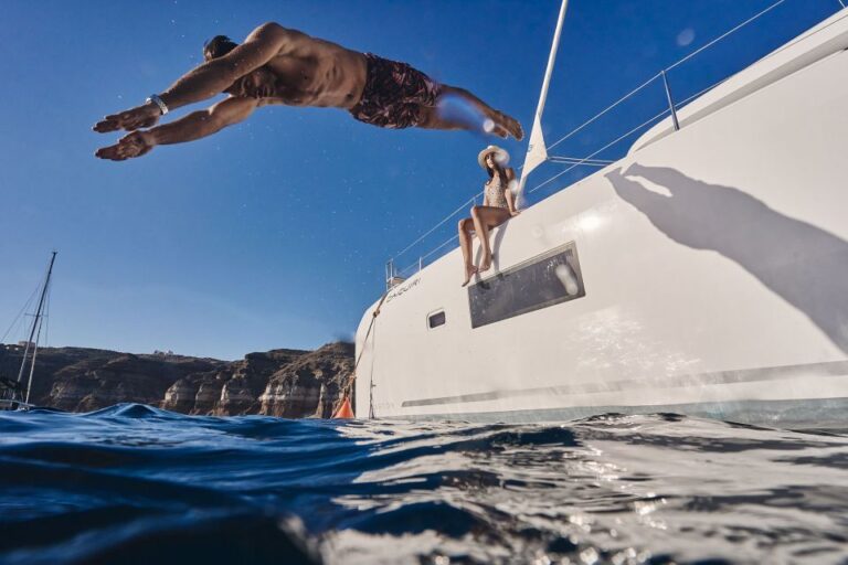 Santorini: Southern Island Luxury Catamaran Cruise with Meal