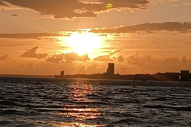Sunset sailing boat trip in Lisbon with snacks