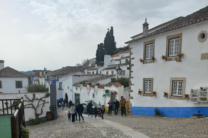 Transfer to Porto with Óbidos, Nazaré and Aveiro
