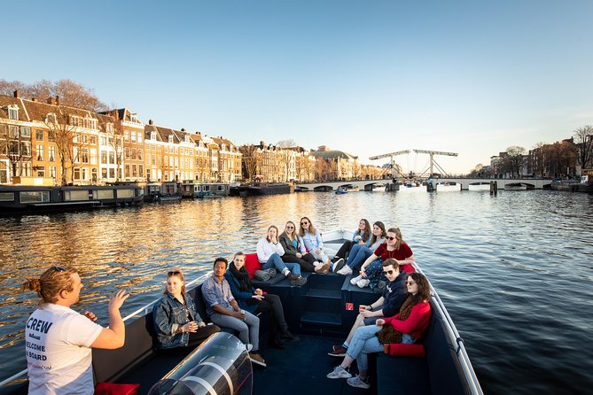 Discover Amsterdam's Canals: Relaxing Open Boat Cruise Adventure! - The Sum Up