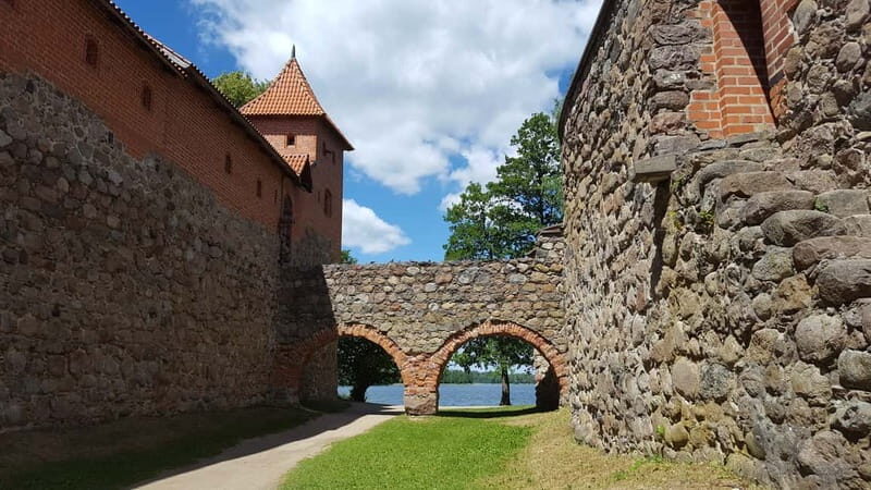 From Vilnius: Trakai Castle and Paneriai Memorial Tour - The Itinerary Breakdown