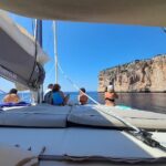 Full day catamaran tour in Alghero - Detailed Breakdown of the Itinerary