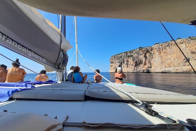 Full day catamaran tour in Alghero - Detailed Breakdown of the Itinerary