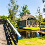 Amsterdam: Giethoorn Tour with Boat Ride & Afsluitdijk Visit - The Itinerary in Detail