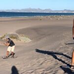 Slide into the sunset by Sandboarding in Las Dunas Del Mogote - Practical Details and Tips for Travelers